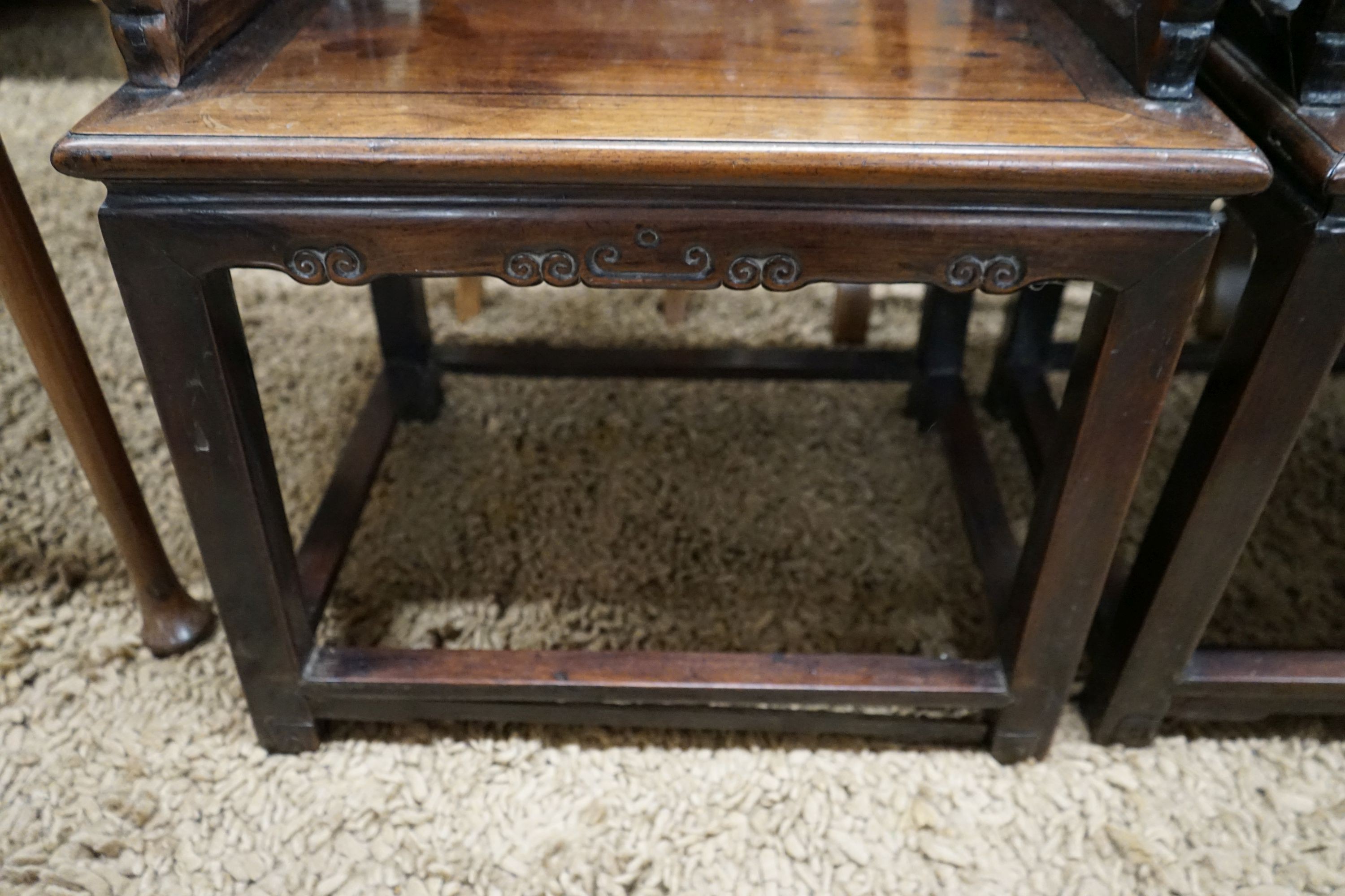 A pair of Chinese carved hongmu elbow chairs (a.f.), width 65cm, depth 48cm, height 96cm